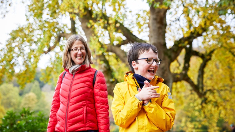 Visitors in the garden in autumn at Stourhead, Wiltshire